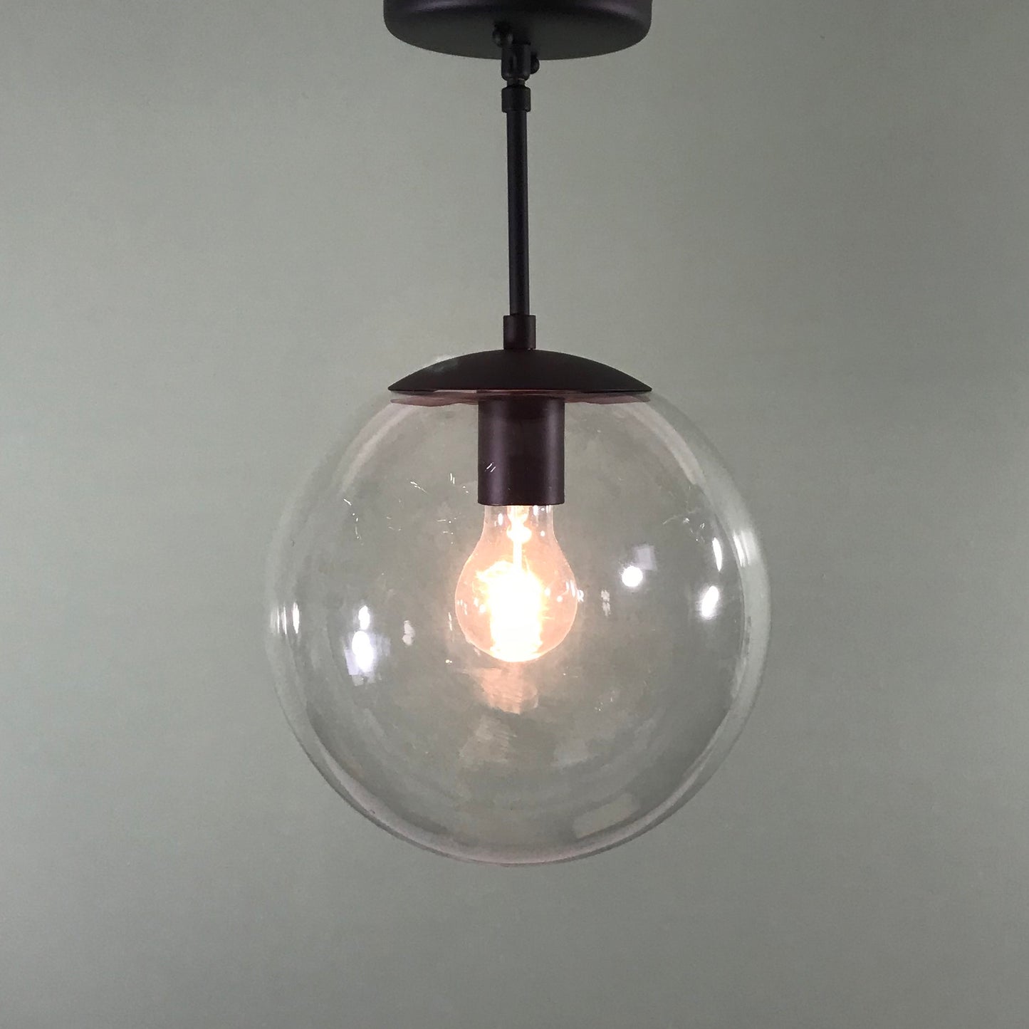 Mid Century Modern 10" Clear Glass Globe Pendant in Matte Black