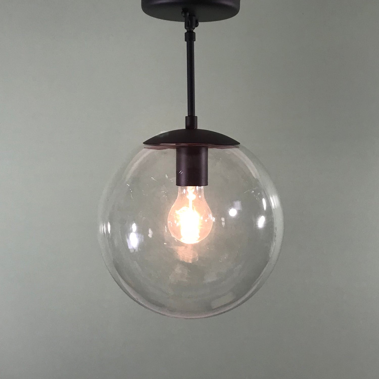 Mid Century Modern 10" Clear Glass Globe Pendant in Matte Black