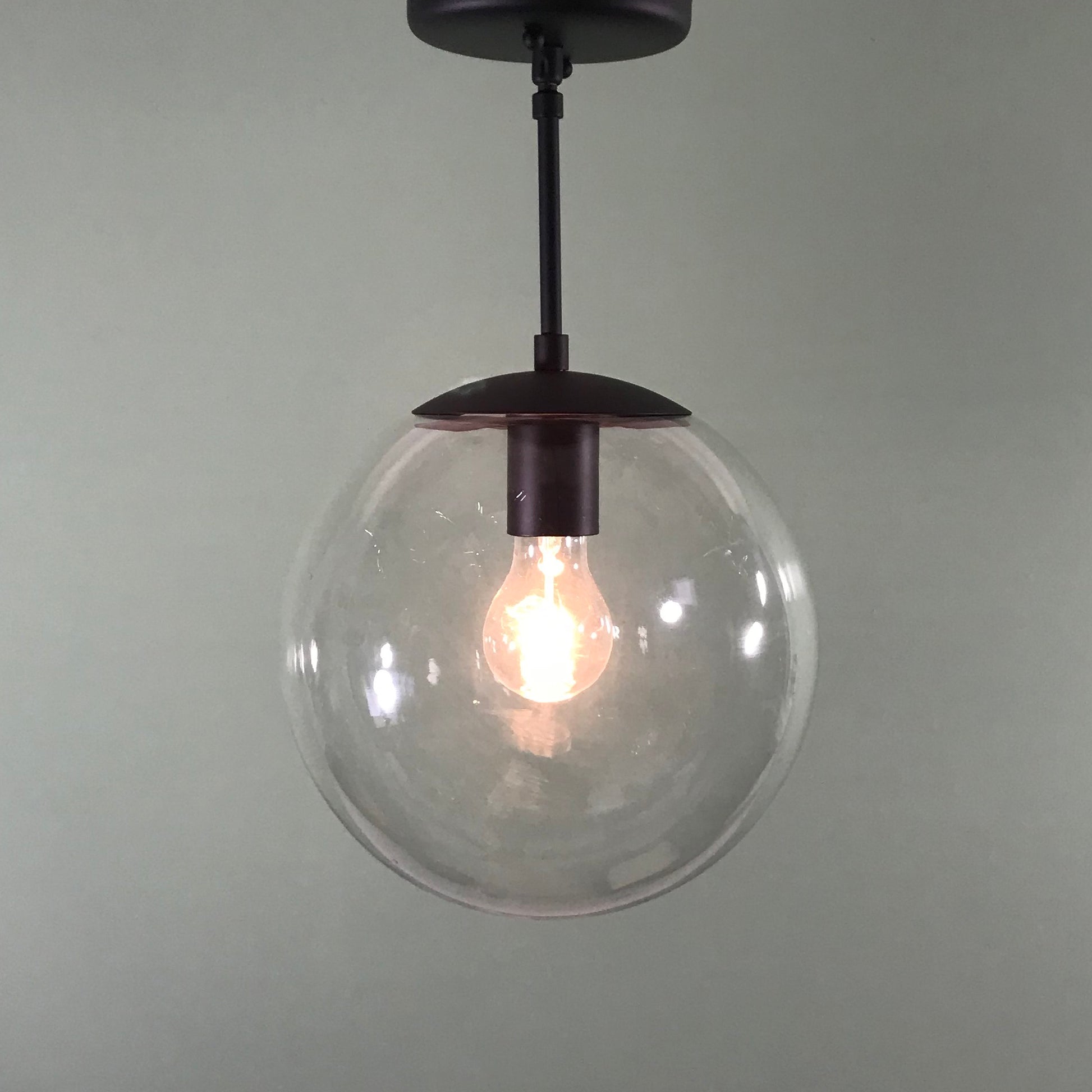 Mid Century Modern 10" Clear Glass Globe Pendant in Matte Black