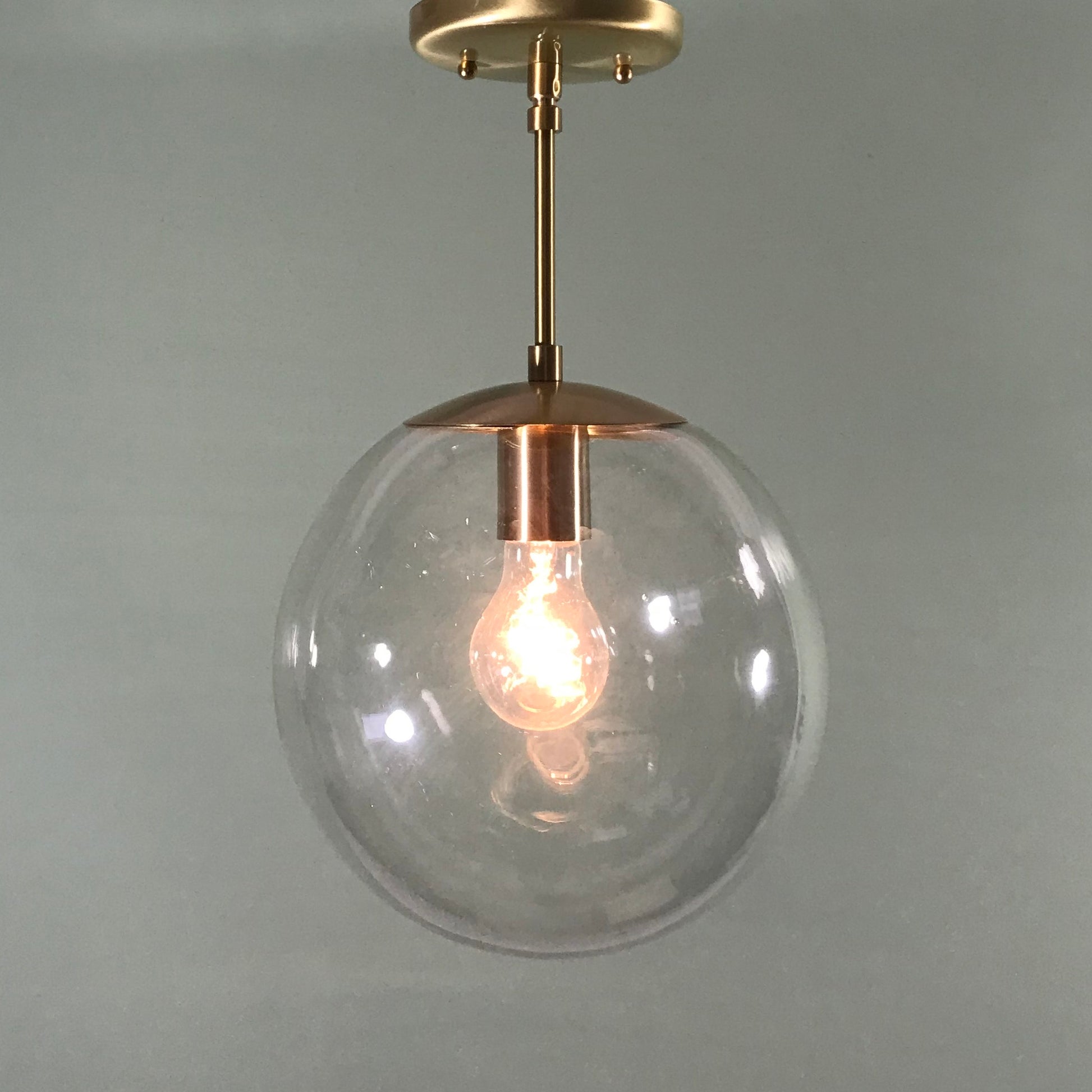 Mid Century Modern 10" Clear Glass Globe Pendant in Satin Brass